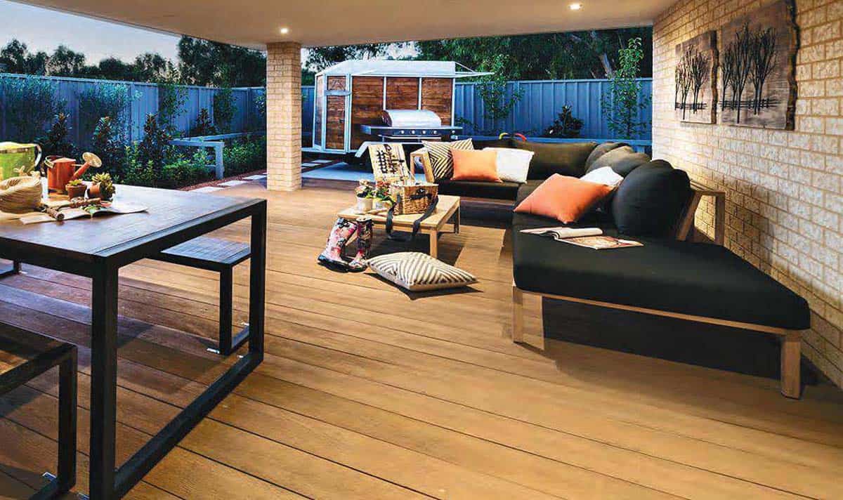 Millboard Enhanced Golden Oak deck boards create an warm relaxing area in an alfresco