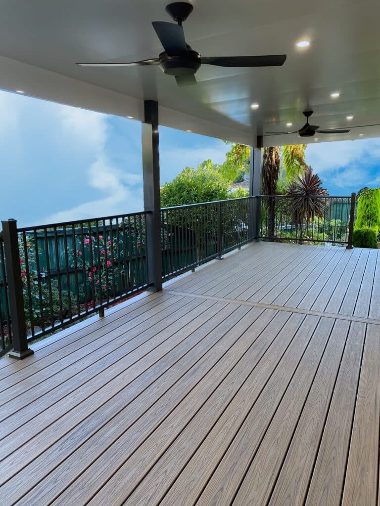 Trex Havana Gold composite decking combined with and Insulated panel pergola