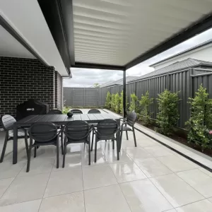 A louvered pergola adds an extra dining area for this home in Oran Park